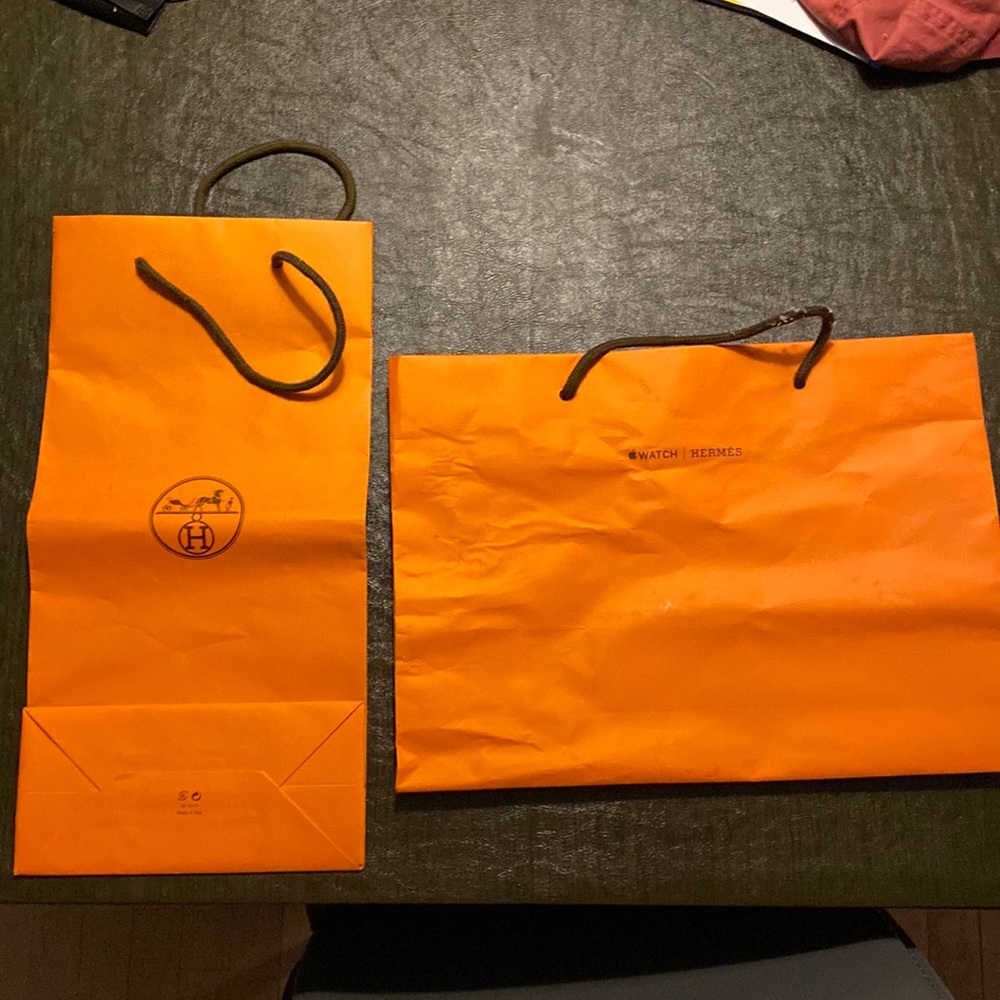 Two Hermès shopping bags and ribbon. 1 Apple Watch Hermes other Hermes logo bag